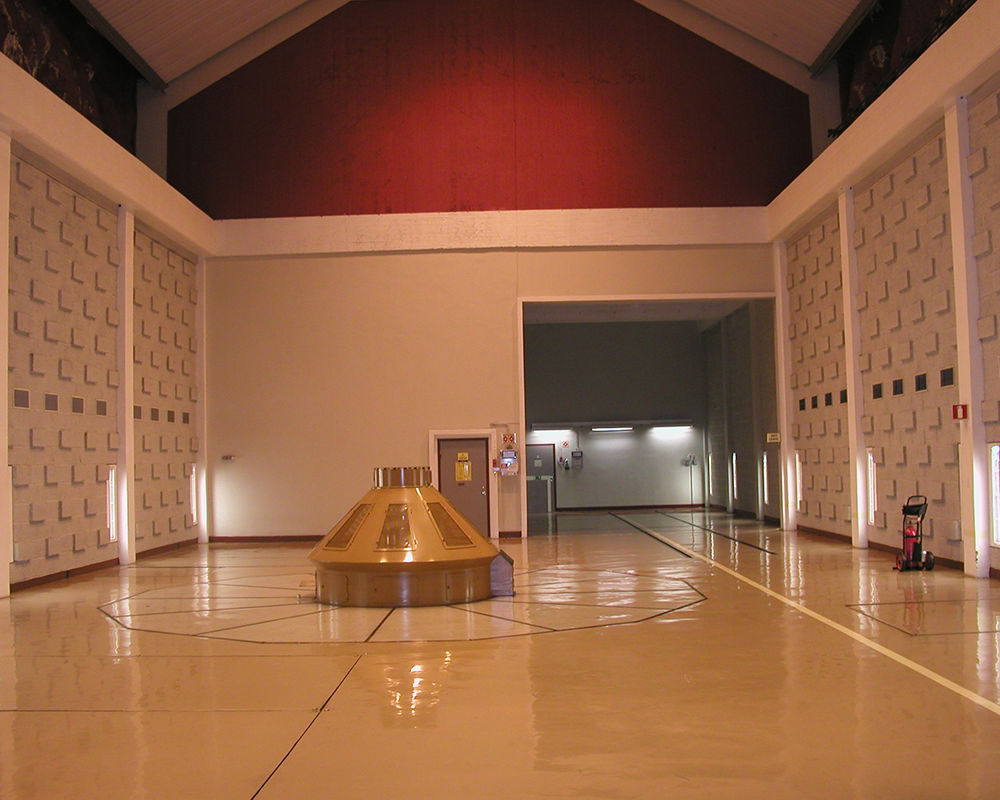 Machine room with tops of generating units visible above floor level